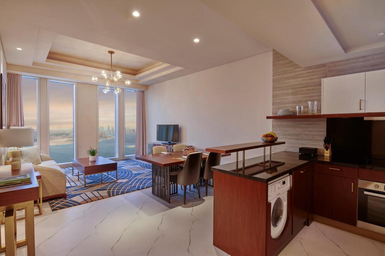 Wyndham Grand Doha West Bay Beach Bagian luar foto A typical apartment interior