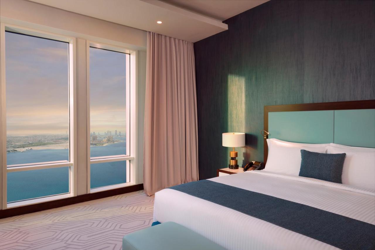 Wyndham Grand Doha West Bay Beach Bagian luar foto A bedroom at the Address Downtown Dubai
