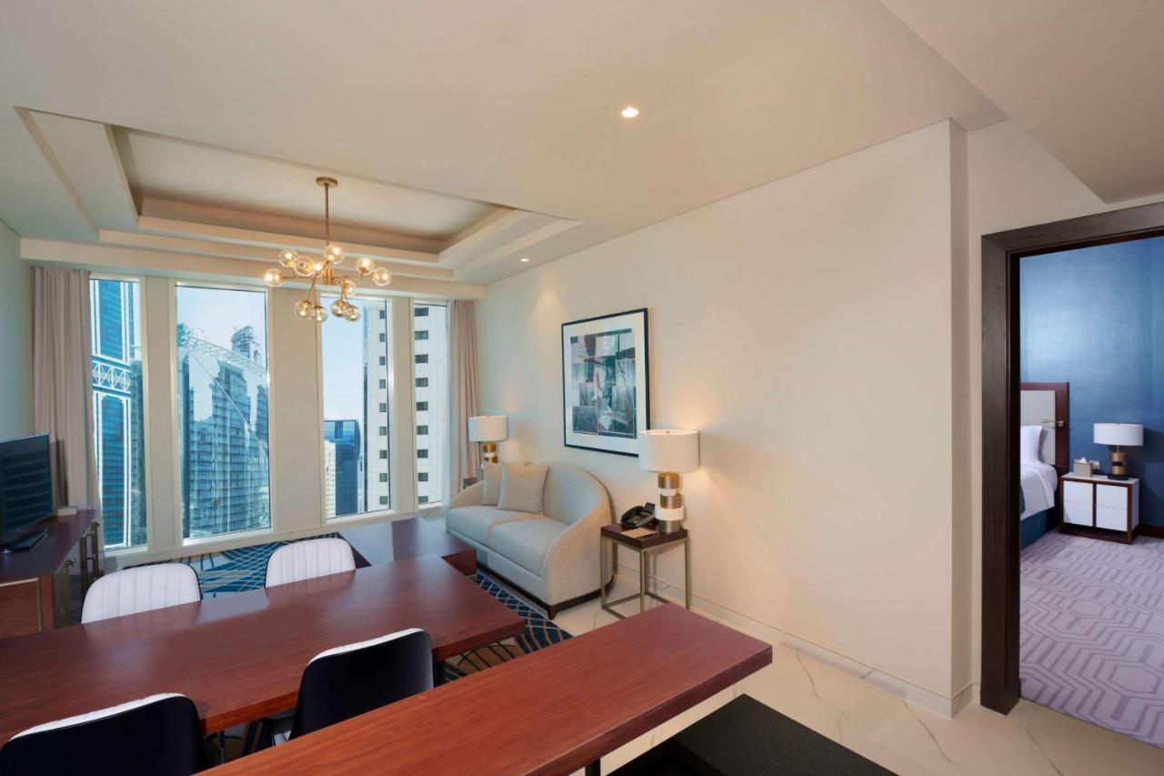 Wyndham Grand Doha West Bay Beach Bagian luar foto A suite at the hotel