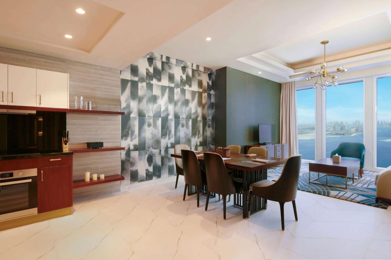 Wyndham Grand Doha West Bay Beach Bagian luar foto A typical apartment interior